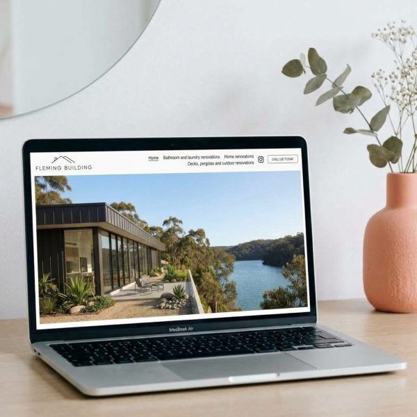 Fleming Building website shown on a laptop